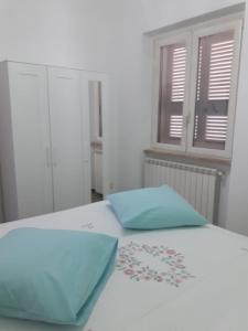 Postel nebo postele na pokoji v ubytování Villetta al mare con ampio giardino privato + 7 fotografií