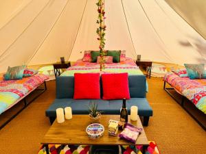 a room with a bed in a tent at River View Glamping in Llandovery