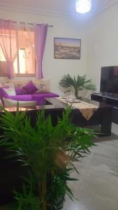 Una televisión o centro de entretenimiento en au cœur de L'orient Marrakech