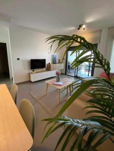a living room with a couch and a table at Viva La Zenia in Orihuela Costa