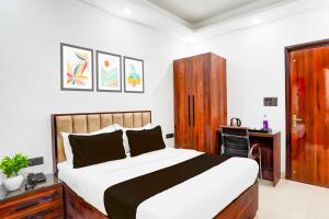 Postel nebo postele na pokoji v ubytování Hotel O 63 A Noida + 15 fotografií