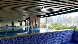 a swimming pool with a view of a city at FREE Parking City lights AlexaVoice Control Unit in Manila