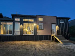 a home with a black exterior with a house at One Night with the Stars in Arroyo Seco
