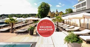 Et logo, certifikat, skilt eller en pris der bliver vist frem på Falkensteiner Schlosshotel Velden – The Leading Hotels of the World