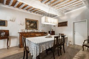 a dining room with a table and chairs at Villa Ott in Crespina