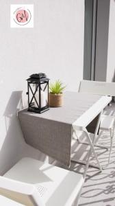 a table with a black lantern on top of it at GM Family in Siderno Marina