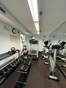 a gym with several treadmills and cardio machines at MainStay Suites Sterling near Dulles Town Center in Sterling