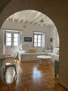 a living room with a couch and a table at Villa Iza in Skala