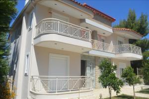 a building with balconies on the side of it at Twin Villa 2 in Melission
