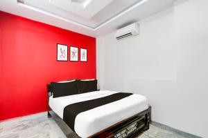 Ένα ή περισσότερα κρεβάτια σε δωμάτιο στο Hotel O Lavish Stay Inn