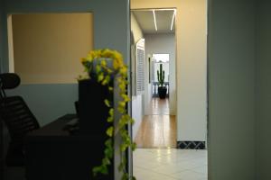 a hallway with a hallway leading into a room at Estação da XV in Telêmaco Borba