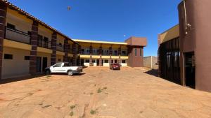 an empty parking lot in front of a building at Hotel Itiquira in Formosa +35 photos