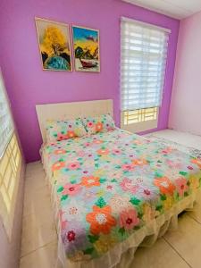 Ένα ή περισσότερα κρεβάτια σε δωμάτιο στο Janaida Homestay Alor Setar