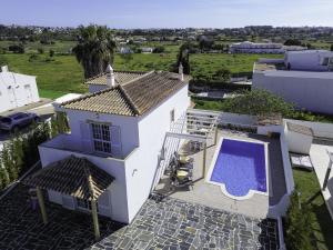 an aerial view of a house with a swimming pool at Villa Menina by Ocvillas in Albufeira