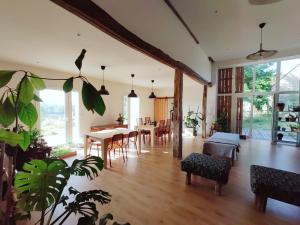 a living room with a dining room and a table at Oacisse in Coulanges
