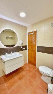 a bathroom with a sink and a toilet at Nomad Haux in the heart of Tossa 6 in Tossa de Mar