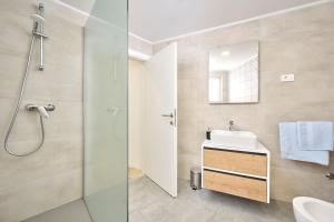 a bathroom with a sink and a shower at Apartments Elettra in Umag +22 photos