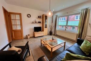 a living room with a couch and a coffee table at Baalmann Nr3 in Borkum