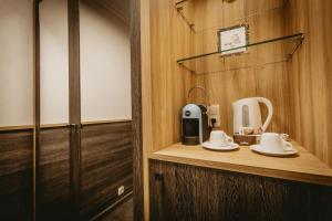 a room with a counter with a coffee maker on it at Hotel ZOO Sofia in Sofia