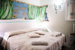 Ένα ή περισσότερα κρεβάτια σε δωμάτιο στο Agriturismo Il Murales