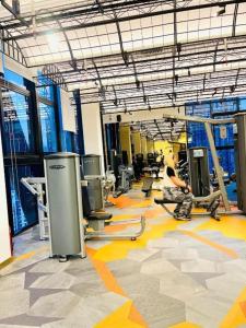 a gym with a man working out in a gym at Scarletz klcc by R&R in Kuala Lumpur