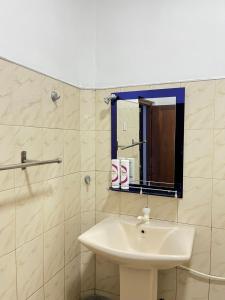 a bathroom with a sink and a mirror at Two Bedroom Villa Tangalle in Tangalle +32 photos