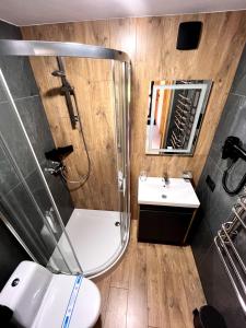 a bathroom with a shower and a sink at GomuL in Vorokhta +45 photos