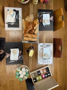 a table topped with lots of different types of food at Chambre d'hôte à Sieck in Santec