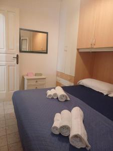 Ένα ή περισσότερα κρεβάτια σε δωμάτιο στο Flore's House Ostuni +18 φωτογραφίες