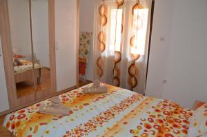 Postel nebo postele na pokoji v ubytování MG apartments and rooms