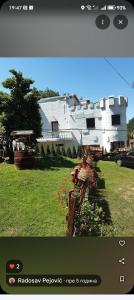 a screenshot of a house with a picture of a yard at Castelo 2025 in Vrnjačka Banja