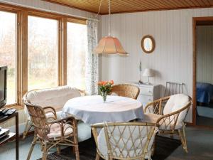 a dining room with a table and chairs at 4 person holiday home in Heberg in Heberg