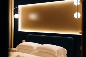 a room with a bed with two pillows on it at SetSail in Vibo Valentia Marina
