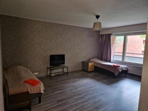 Giường trong phòng chung tại LibO-apartment, Myllymäki 5,22