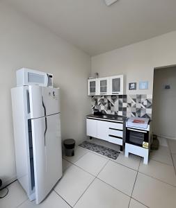 Kuchyň nebo kuchyňský kout v ubytování Apto. Aconchego familiar c/cozinha até 06 pessoas