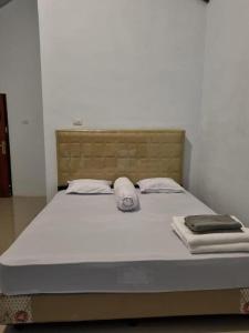 a large bed in a room with a mattressvisor at Sawah Resto Bungalow & Jungle Trekking in Bukit Lawang +31 photos