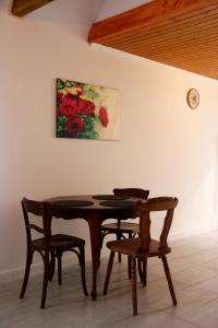 a dining room with a table and two chairs at Riverhouse in Kandern