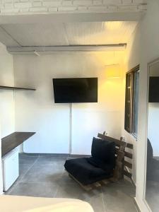 TV a/nebo společenská místnost v ubytování Yabás Praia