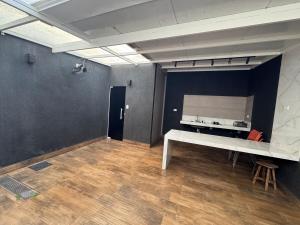 a room with a table and a mirror on a wall at CASA Vila Braz - Pirassununga, SP in Pirassununga +9 photos