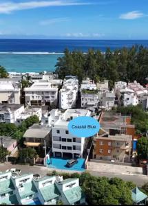 an aerial view of a city with the ocean at Cozy Corner 1 in Flic-en-Flac