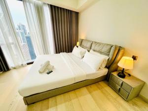 Ένα ή περισσότερα κρεβάτια σε δωμάτιο στο Star KLCC By B&B +75 φωτογραφίες