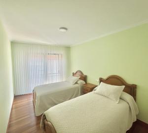 Postel nebo postele na pokoji v ubytování Apartamento Bellavista