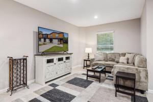a living room with a couch and a table at Isabella Ct Townhome in Orange Park