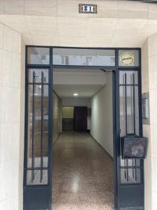 an entrance to a building with an open door at City centro 5th Floor sin ascensor No Lift Long time good price in Valencia