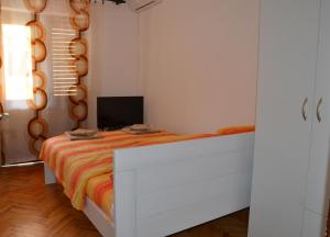 Postel nebo postele na pokoji v ubytování MG apartments and rooms
