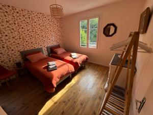 a room with two beds and a staircase in it at Villa Jeanne in Saint-Nazaire-en-Royans