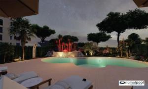 カオルレにあるHotel Maximの- 噴水のあるスイミングプール(夜間)
