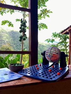 a fan sitting on a table next to a window at Native Heart Amazon Lodge in Shapaja