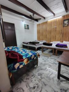 Posezení v ubytování Ayurveda Bhavan Homestay non-Ac & Ac + 25 fotografií