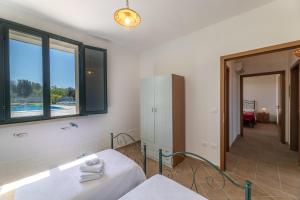 Postel nebo postele na pokoji v ubytování Villa Campagnola + 29 fotografií
